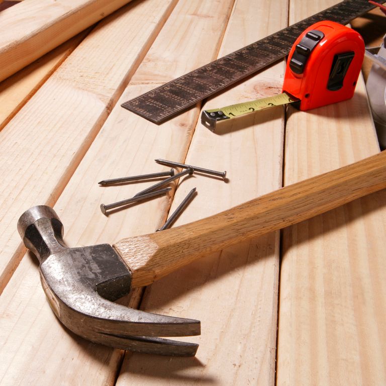 Picture of a hammer, some nails, tape measure and ruler